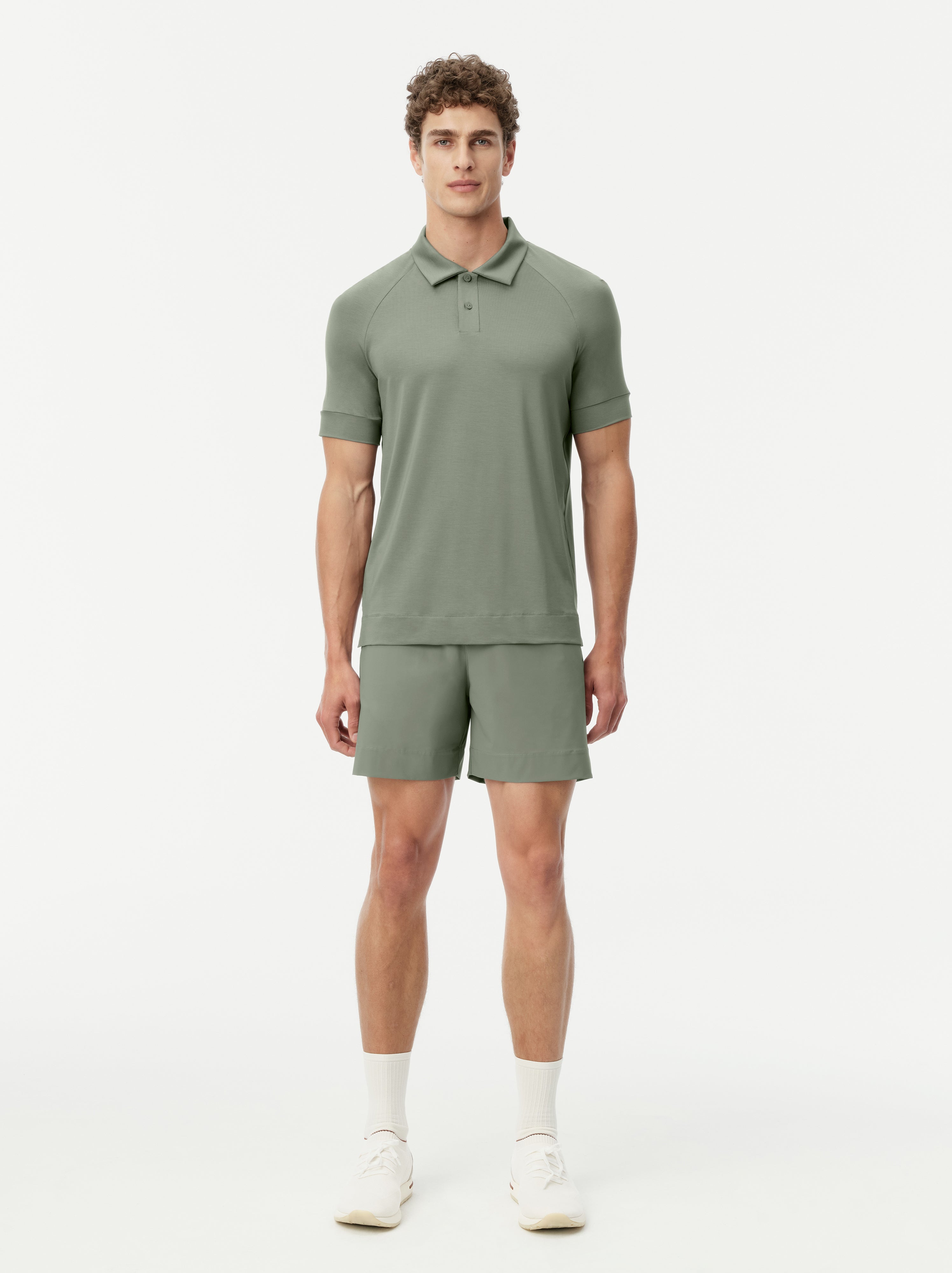 Model wearing the JACQUES Natural Tennis Polo in olive.